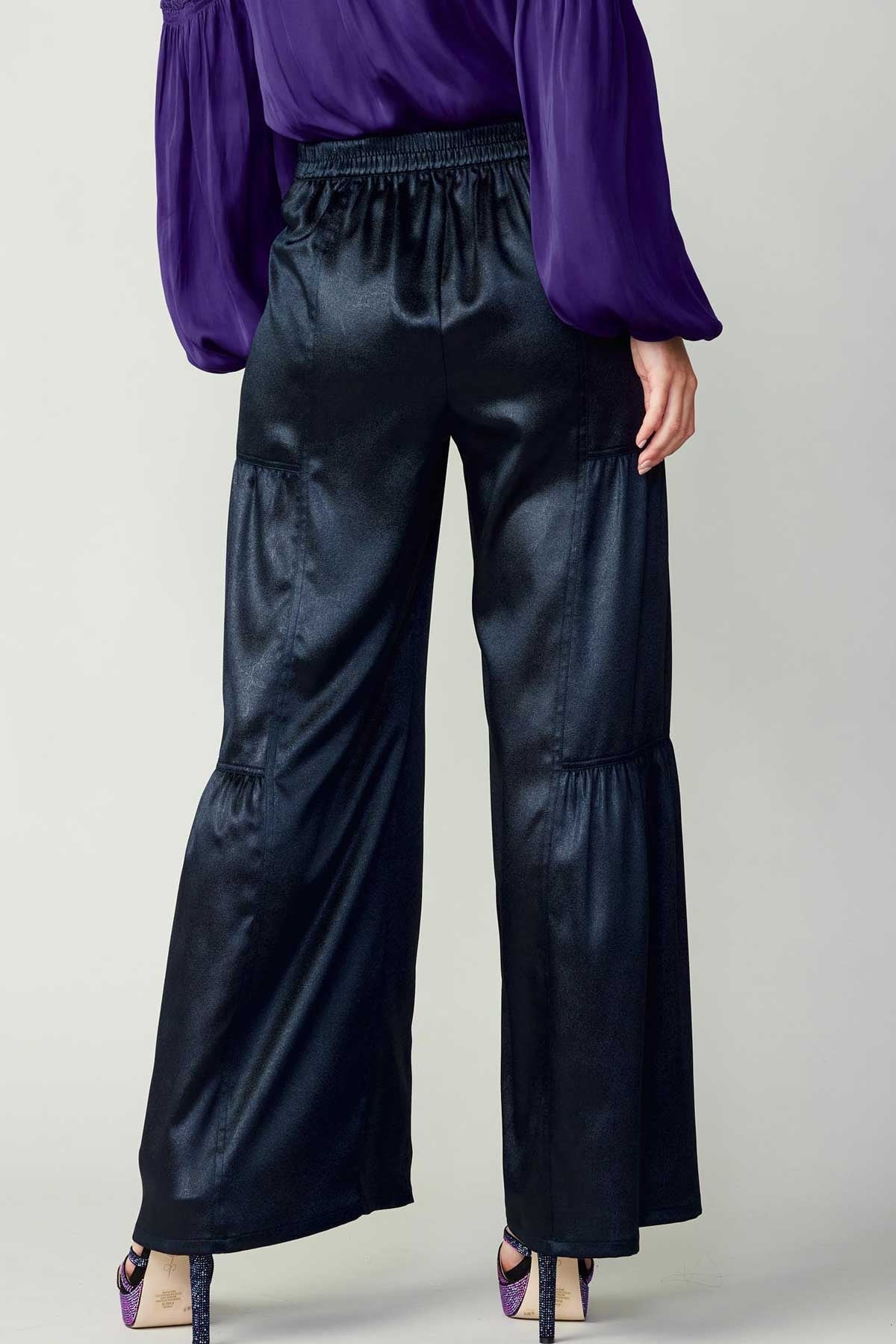 Navy tiered wide-leg pants with elastic at the back waist.