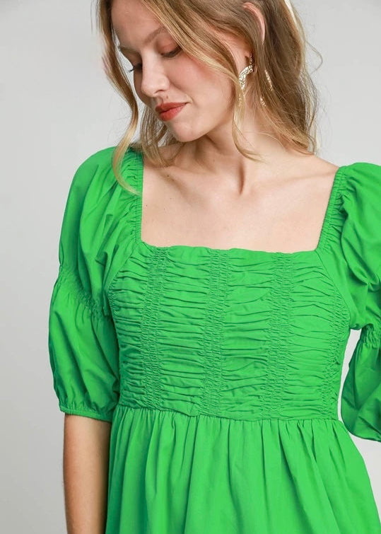 Green smocked half sleeve dress. Smocked. Balloon sleeve.