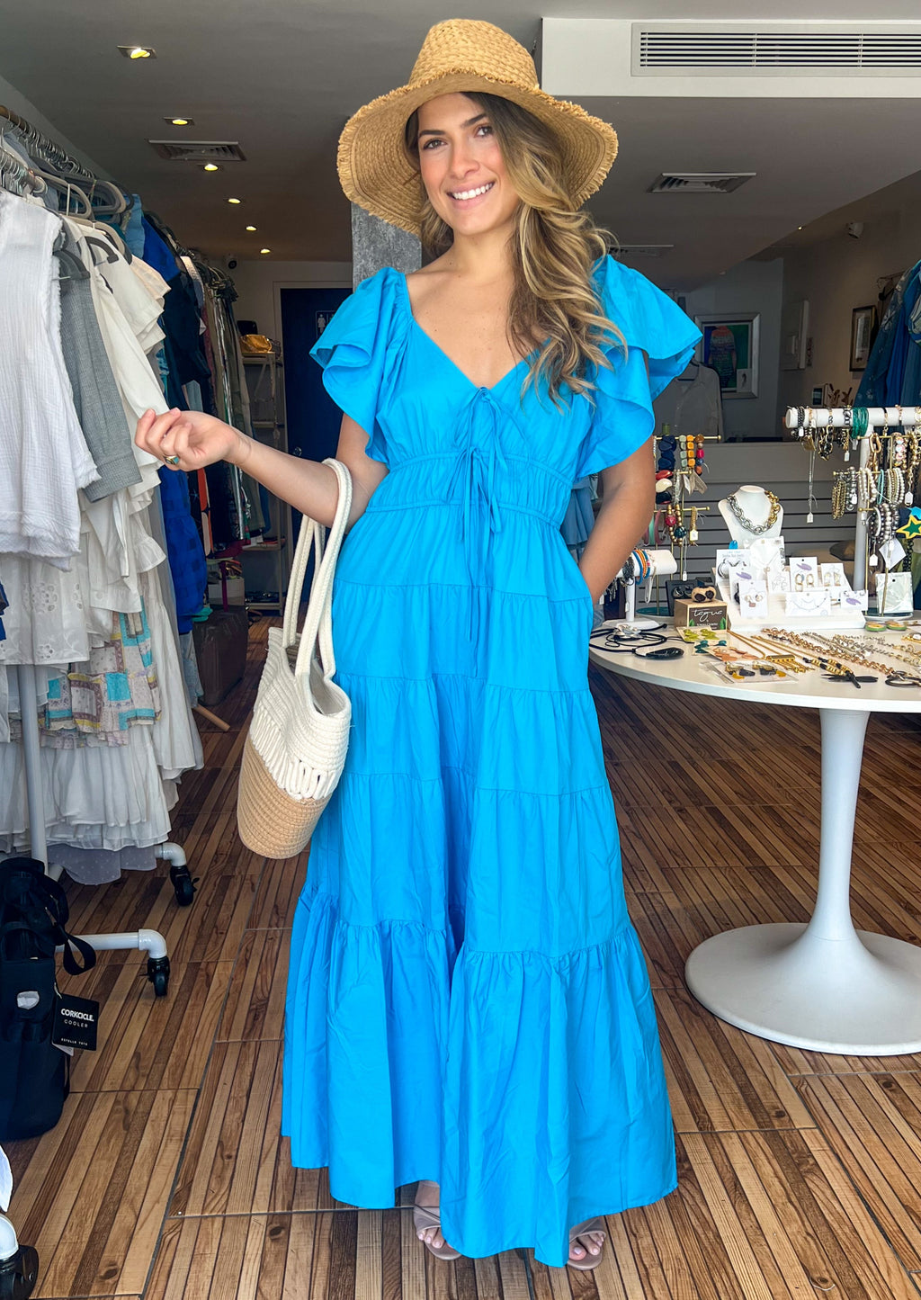 Bright blue tiered maxi dress with ruffle short sleeves and pockets.