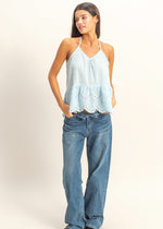 Load image into Gallery viewer, THE DAY IS YOURS TO TAKE IN THIS CHARMING PEPLUM TOP! IT HAS ALL THE DETAILS TO SWEETEN YOUR LOOK, INCLUDING A TIMELESS V-NECK AND DAINTY SHOULDER STRAPS THAT TIE AT THE BACK. VOLUMINOUS PEPLUM TRIM ENDS AT A SCALLOPED LACE HEM. KEYHOLE CUTOUT AT BACK
