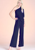 Load image into Gallery viewer, Navy textured solid slouchy one shoulder jumpsuit. The elastic-lined waist and pull-on closure makes this piece both comfortable and easy to wear day to night.
