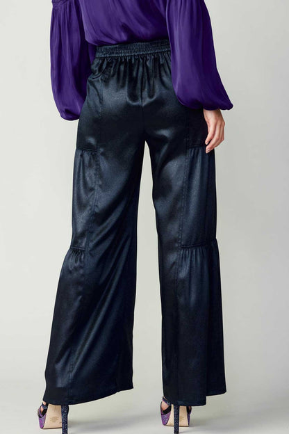Navy tiered wide-leg pants with elastic at the back waist.