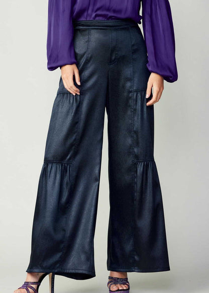 Navy tiered wide-leg pants with elastic at the back waist.