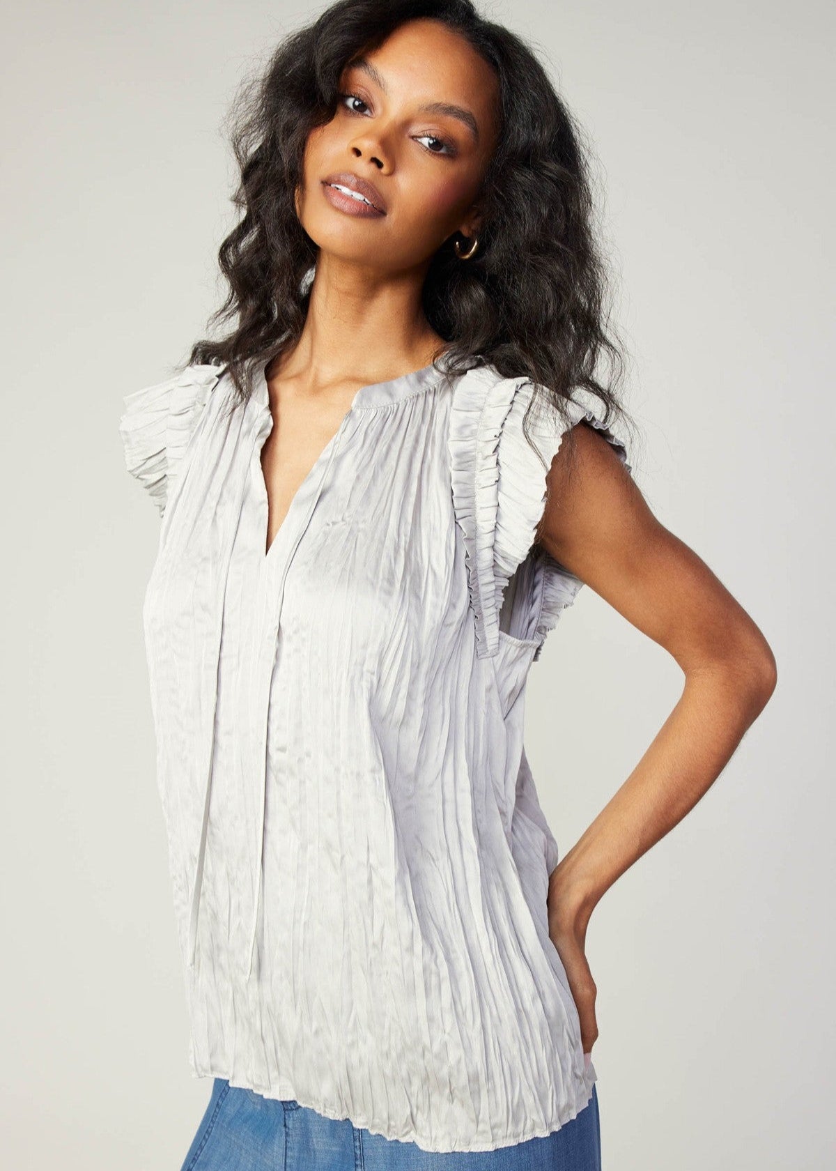 Stone grey ruffle short sleeve split neck crinkle blouse with self tie detail.