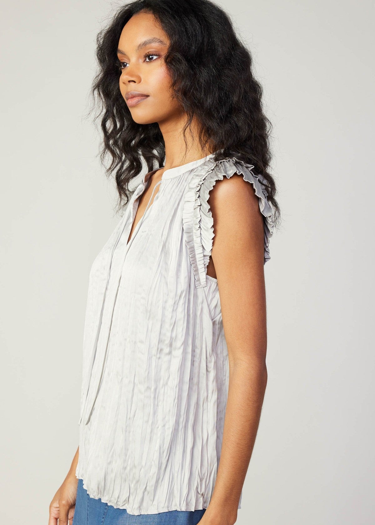 Stone grey ruffle short sleeve split neck crinkle blouse with self tie detail.
