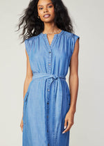 Load image into Gallery viewer, Chambray sleeveless v-neck button down 3/4 length dress with self tie detail on waist and flap pocket on sides.
