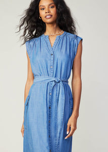 Chambray sleeveless v-neck button down 3/4 length dress with self tie detail on waist and flap pocket on sides.