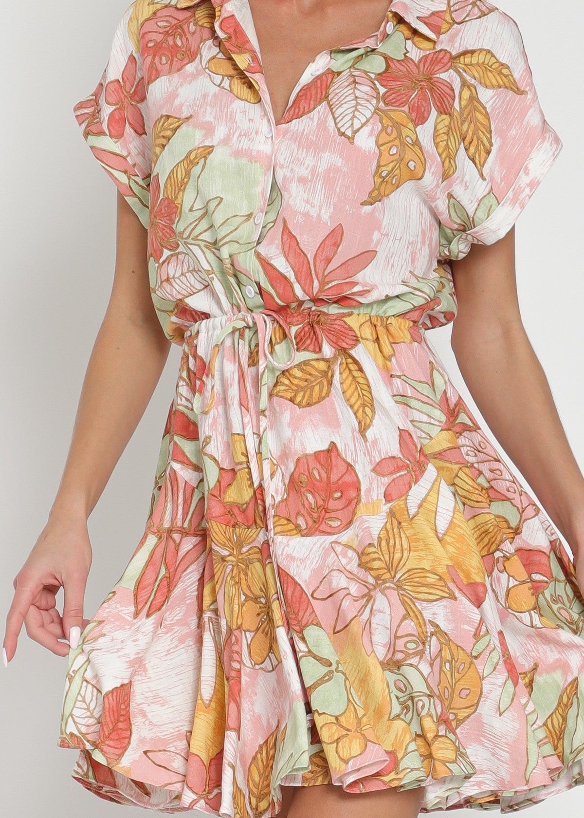 Woman wearing a floral dress with a white background