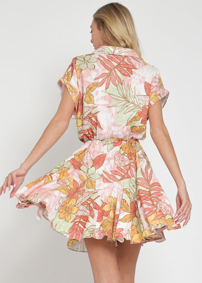 Woman wearing a floral dress with a plain background