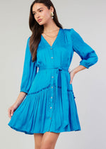 Load image into Gallery viewer, Blue v-neck 3/4 sleeve short button down dress with ruffled detail on skirt.
