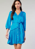 Load image into Gallery viewer, Blue v-neck 3/4 sleeve short button down dress with ruffled detail on skirt.
