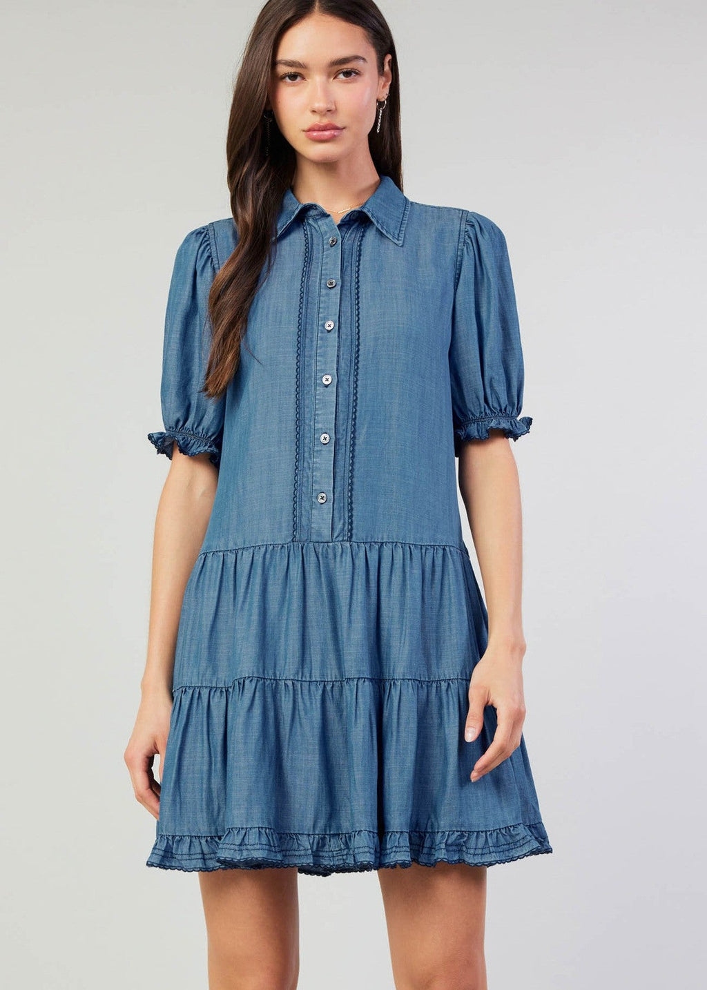 Chambray button down shirt dress with tiered skirt and scallop edge detail on placket & elasticized cuffs.