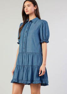 Chambray button down shirt dress with tiered skirt and scallop edge detail on placket & elasticized cuffs.