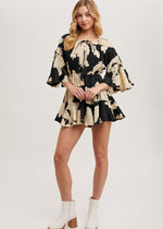 Load image into Gallery viewer, Black floral off the shoulder bell sleeved romper.
