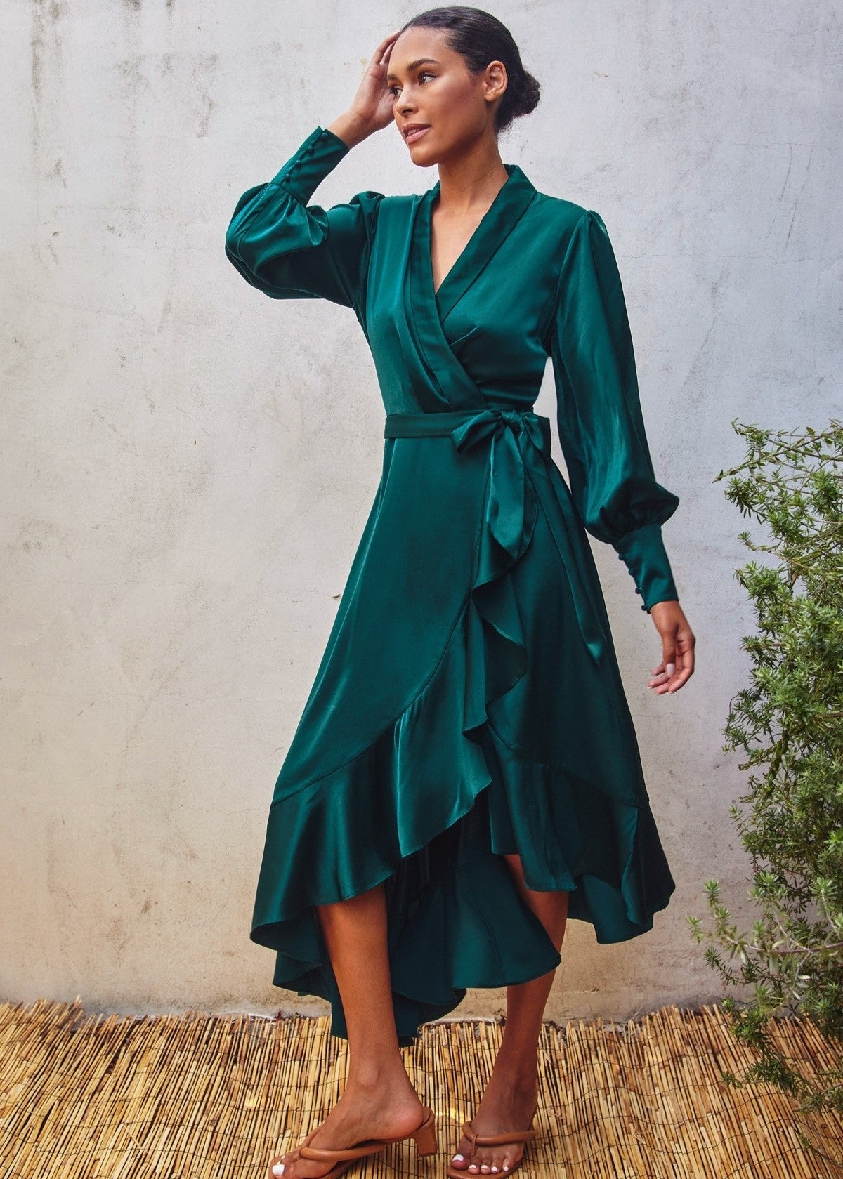 Teal satin midi dress in a wrapping bodice.