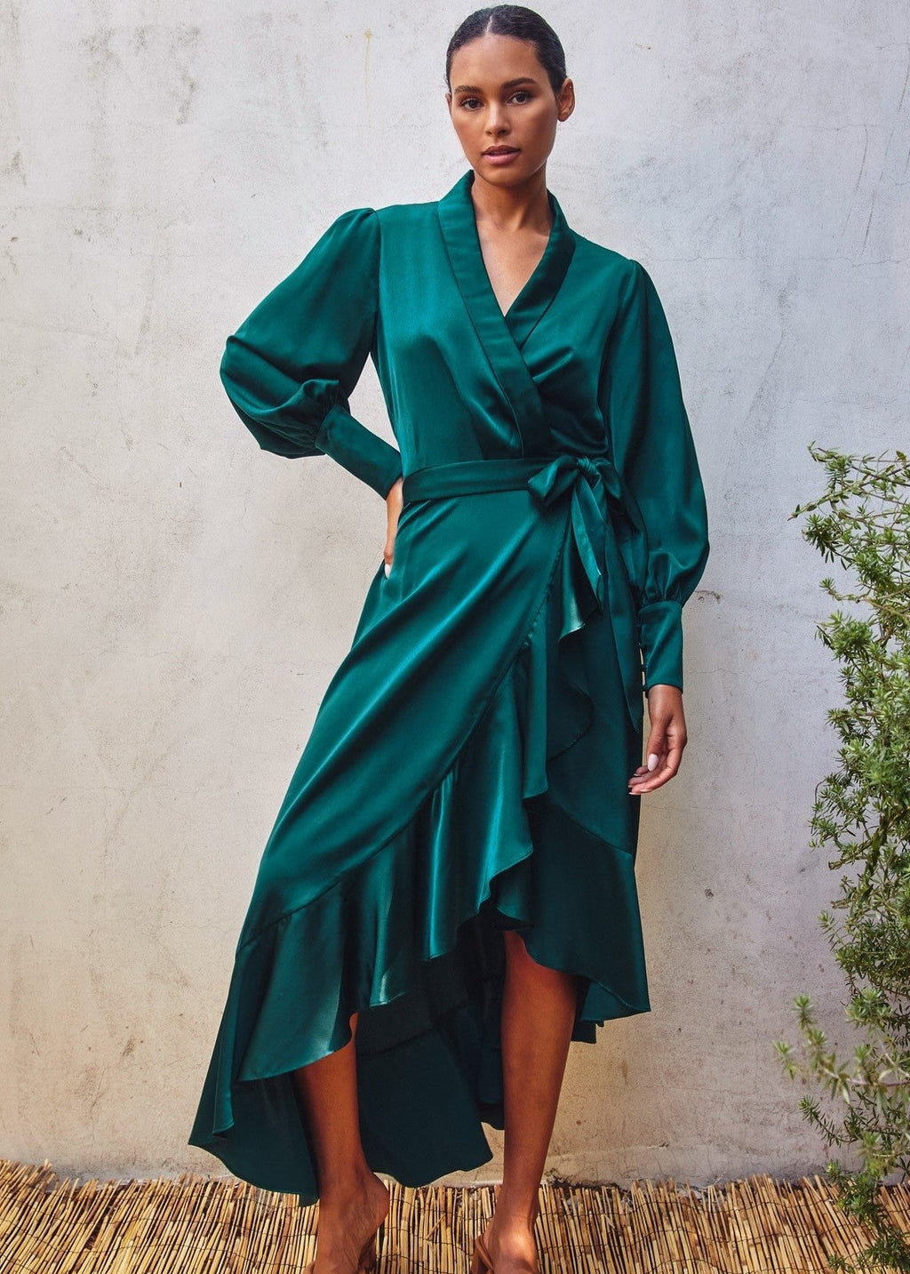 Teal satin midi dress in a wrapping bodice.