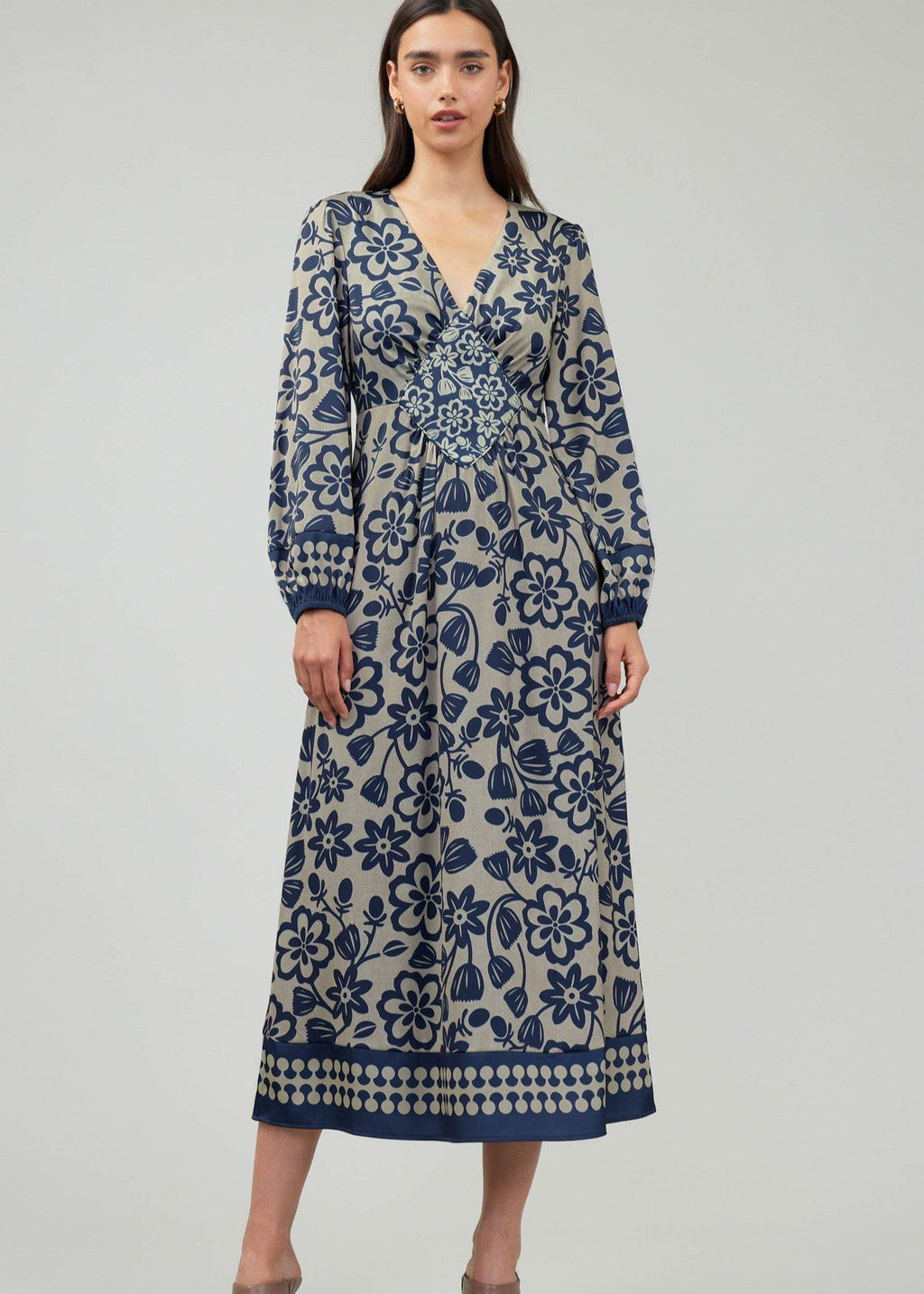 Flower printed long sleeve v-neck maxi dress with piping-framed diamond-shaped inset detail.