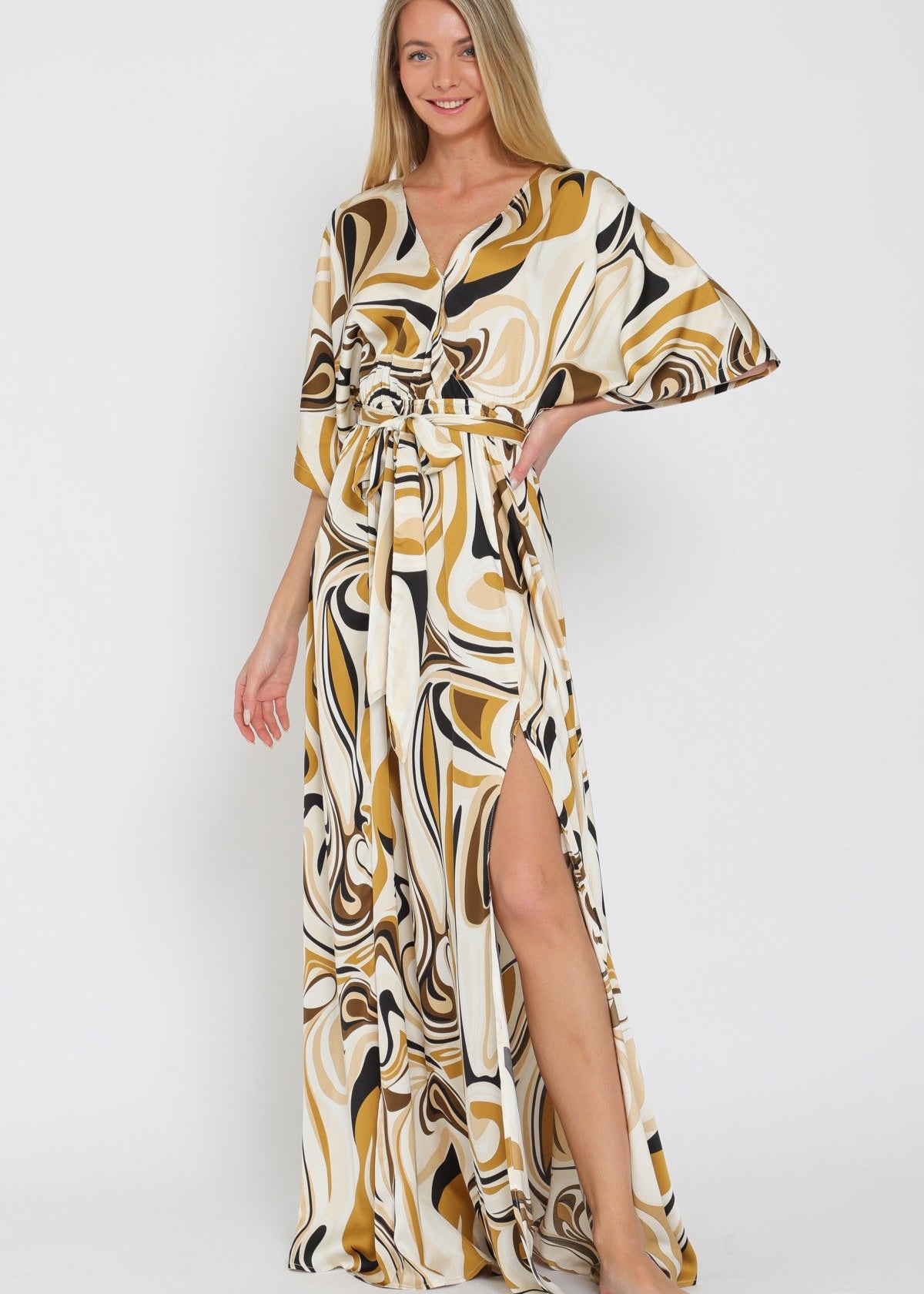 Woman wearing a patterned dress on a white background