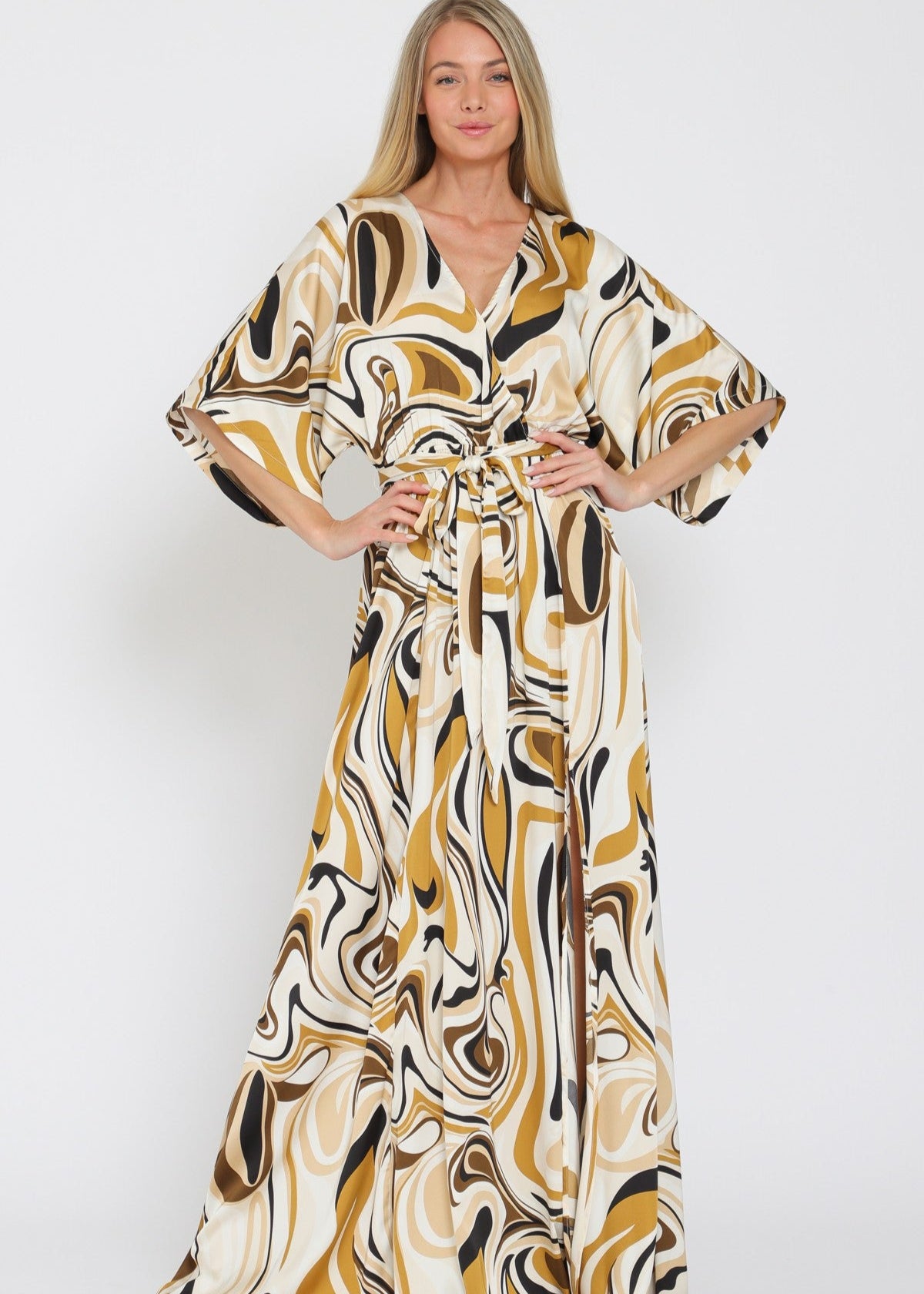 Woman wearing a patterned dress on a white background