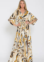 Load image into Gallery viewer, Woman wearing a patterned dress on a white background
