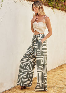 Printed viscose blend wide leg pants. Elastic waist with belt loop. Optional sash belt.