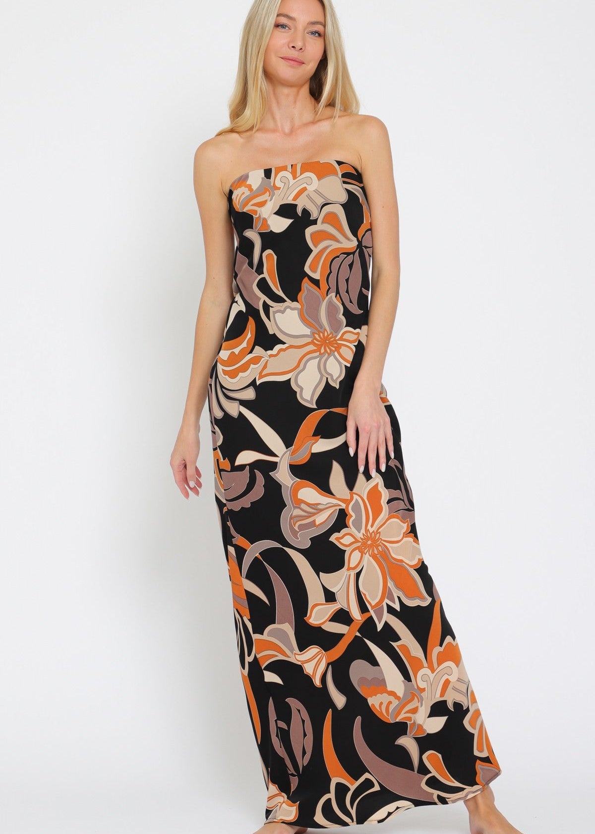 Woman wearing a strapless floral dress on a white background