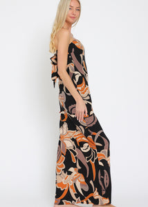 Woman wearing a floral maxi dress on a white background