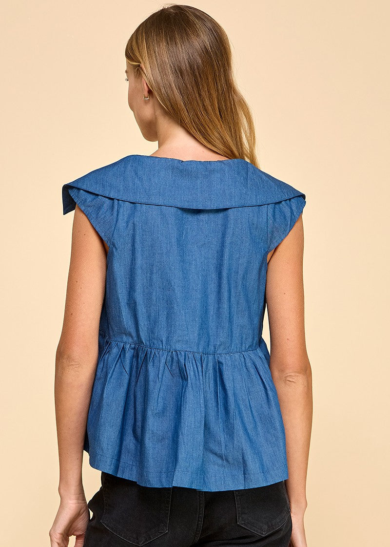 A denim sleeveless top featuring a collared neckline and a wide peplum hem, adding a touch of elegance and flair.