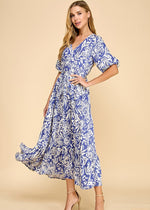 Load image into Gallery viewer, Navy abstract floral print midi dress featuring a V-neck, puffed sleeves, waist tie, and a tiered skirt. Fully lined.

