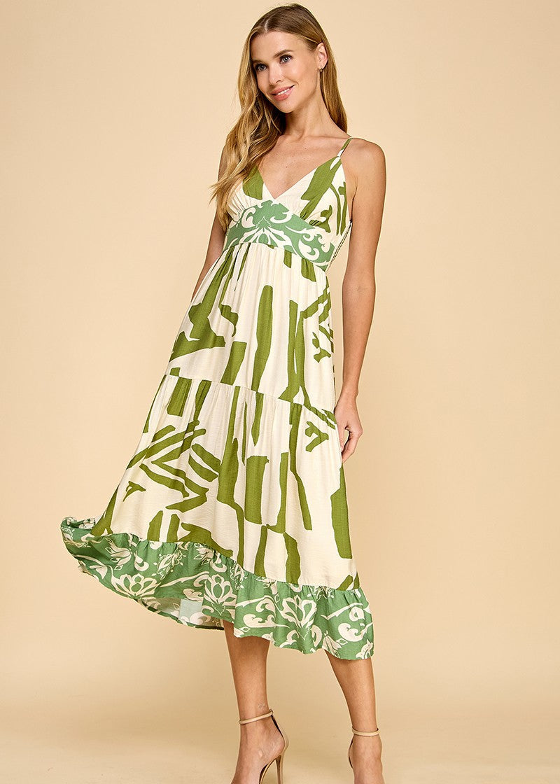 Abstract print midi dress featuring a V-neckline, adjustable spaghetti straps, and a ruffle hem.