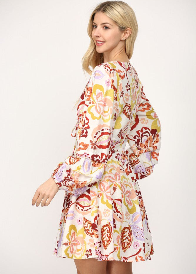 Cream multi print shirred waist v-neck fit and flare short dress.
