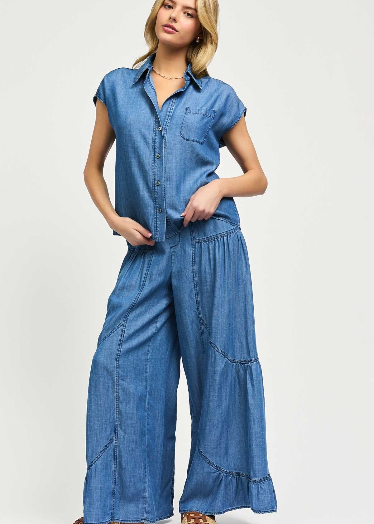 Denim two piece set. Sleeveless split neck boxy top with matching elasticized back waist tiered pants.
