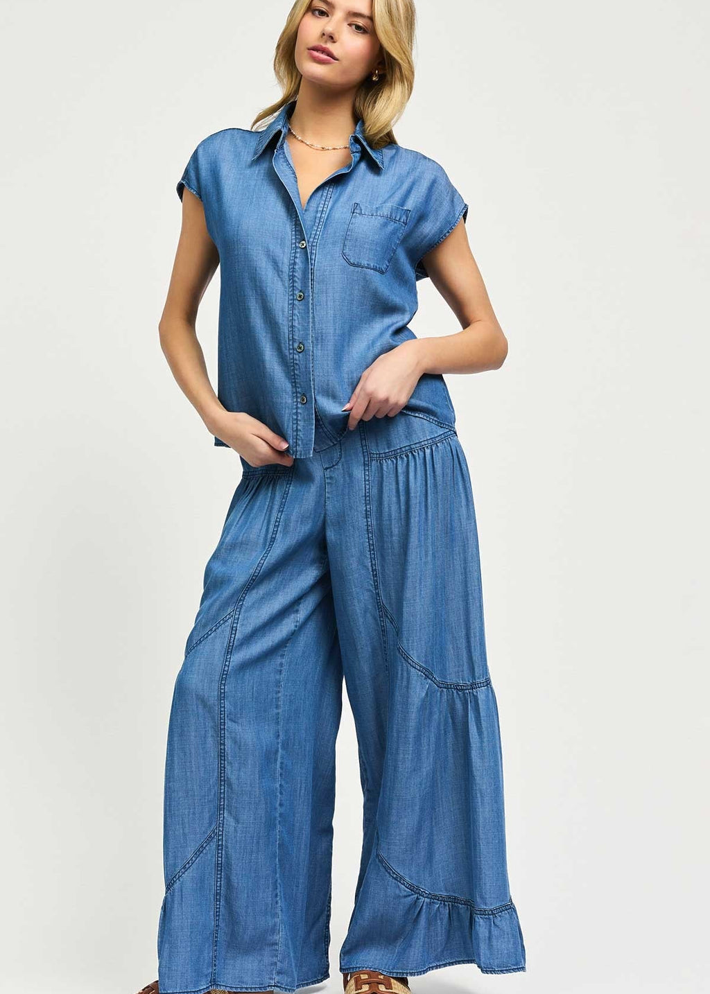 Denim two piece set. Sleeveless split neck boxy top with matching elasticized back waist tiered pants.