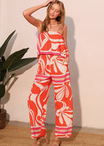 Load image into Gallery viewer, The Sicilia Scarf Cascade Strapless Jumpsuit is a chic and sophisticated one-piece ensemble that combines elegance with modern flair. Featuring a strapless design and a cascading detail, it creates a flattering silhouette while offering effortless movement.
