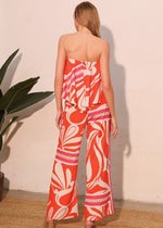 Load image into Gallery viewer, The Sicilia Scarf Cascade Strapless Jumpsuit is a chic and sophisticated one-piece ensemble that combines elegance with modern flair. Featuring a strapless design and a cascading detail, it creates a flattering silhouette while offering effortless movement.
