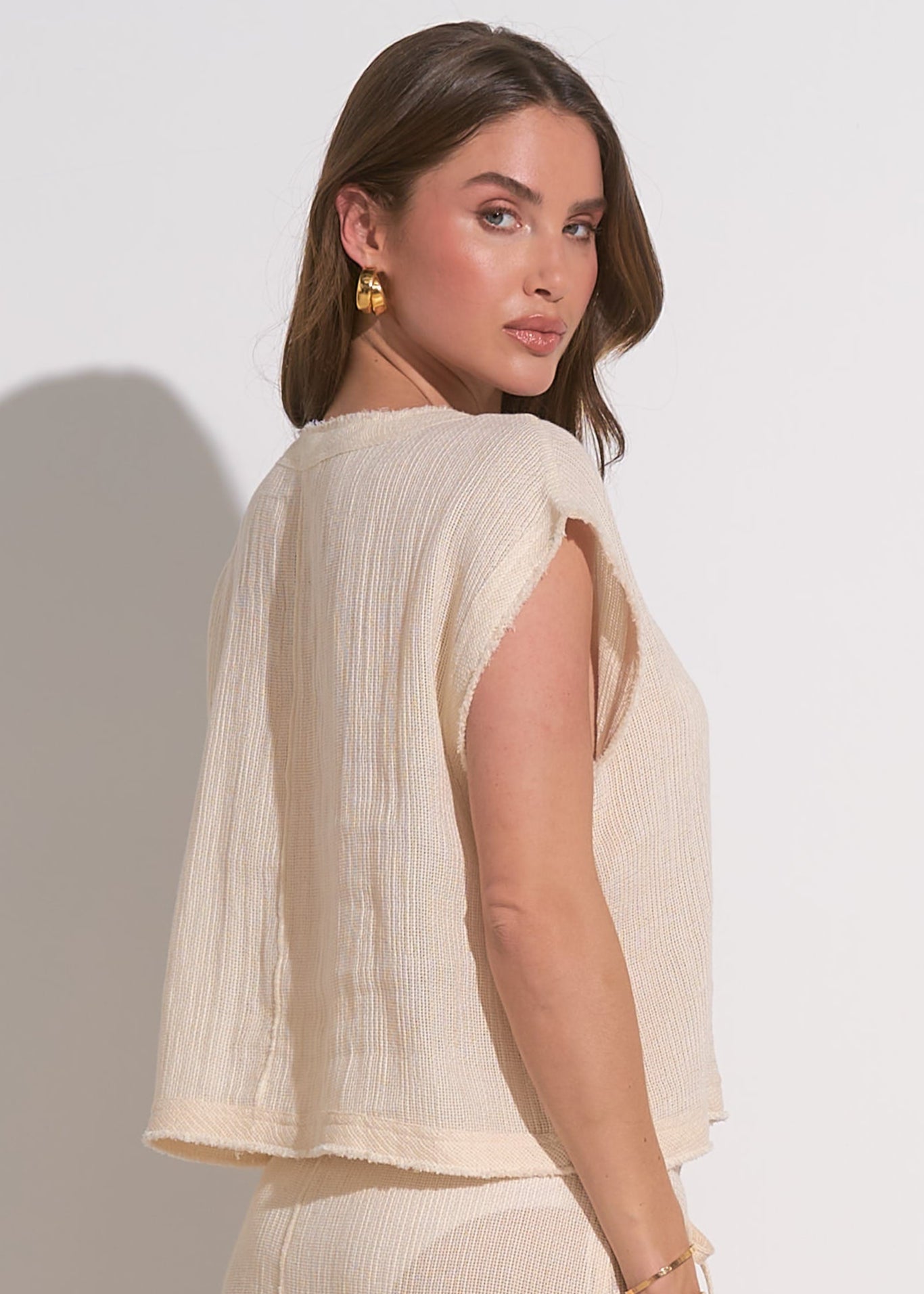 Natural two piece set. Short sleeve top with matching drawstring shorts with pockets.