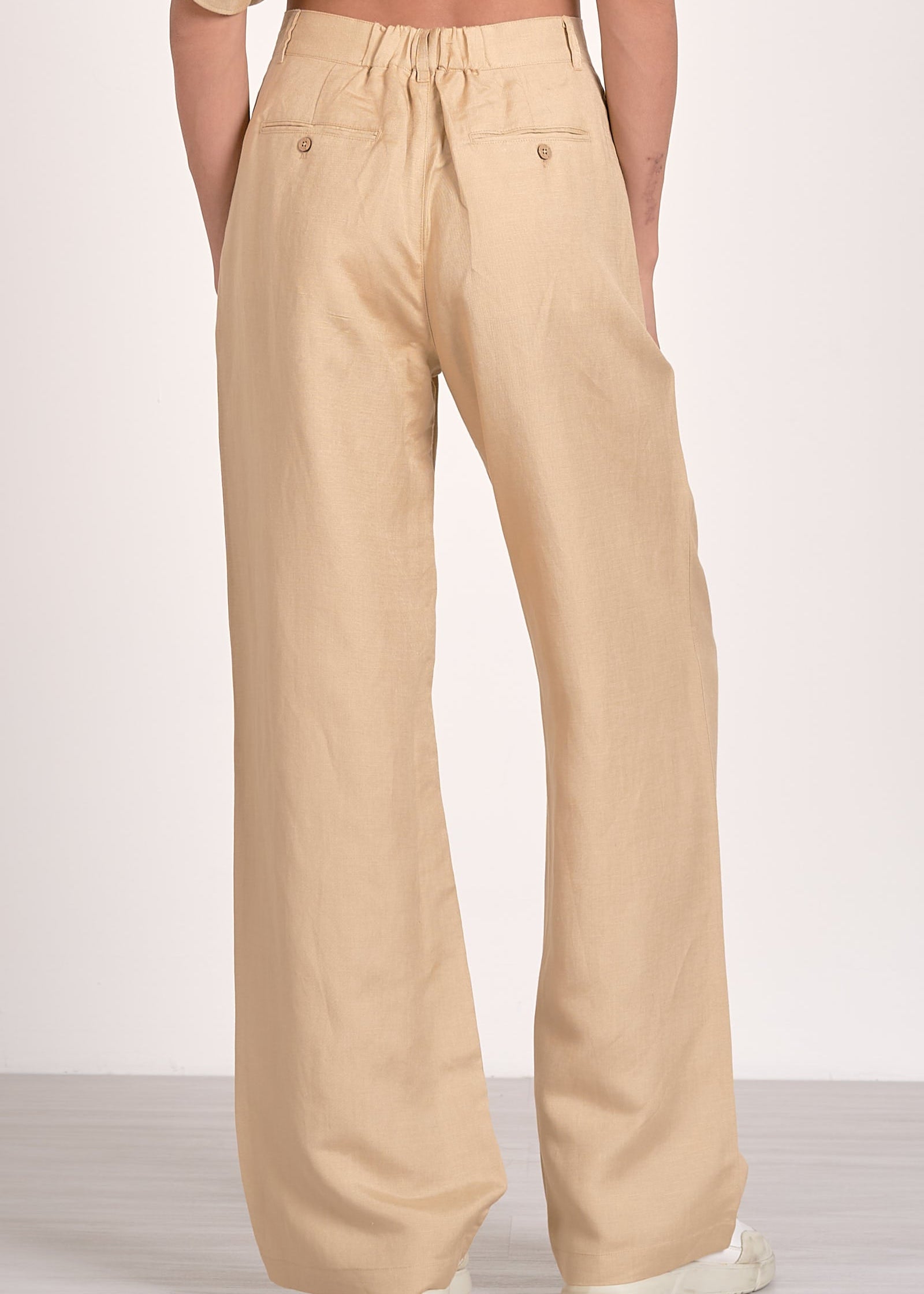 Khaki two piece set. One shoulder top with matching high-waisted pleated front pants.