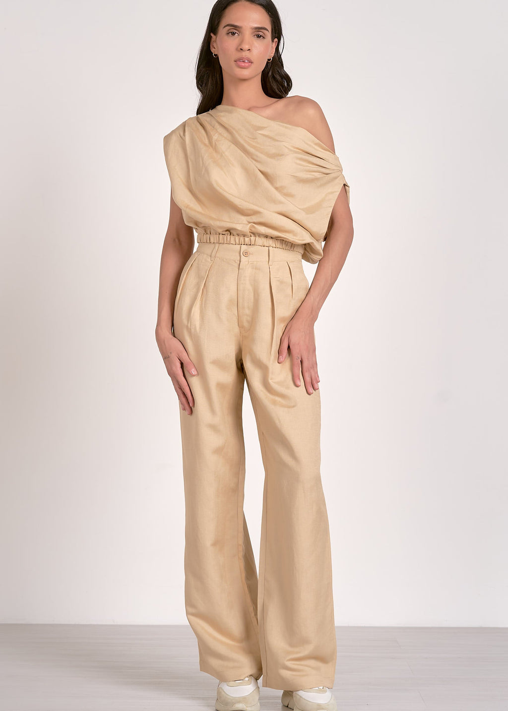 Khaki two piece set. One shoulder top with matching high-waisted pleated front pants.