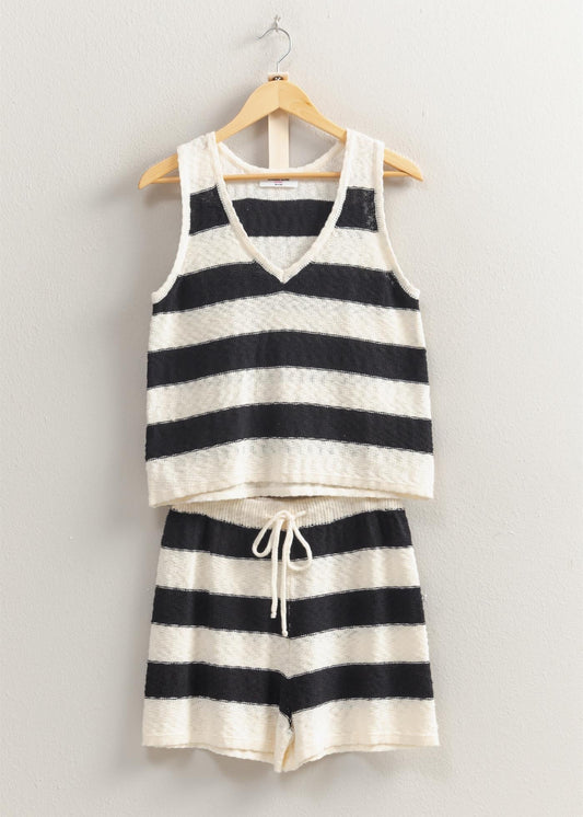 The Sun Is Out, So Slip Into This Set And Head Out. Covered In A Striped Pattern, The Sweater Top Has A V-Neckline With A Sleeveless Bodice That Has A Relaxed Fit. The Matching Shorts Have A Drawstring Waist And A Flowy Silhouette.