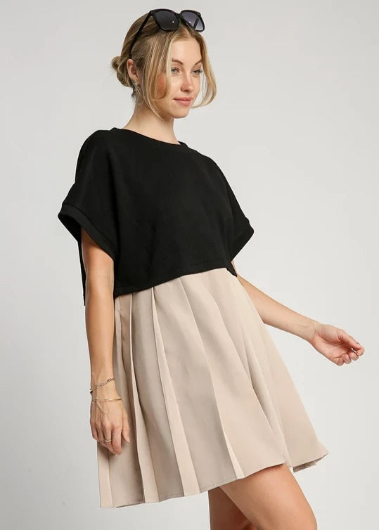 Black and oatmeal round neck knit skirt dress.Jacquard. Pleated skirt. Side pockets.