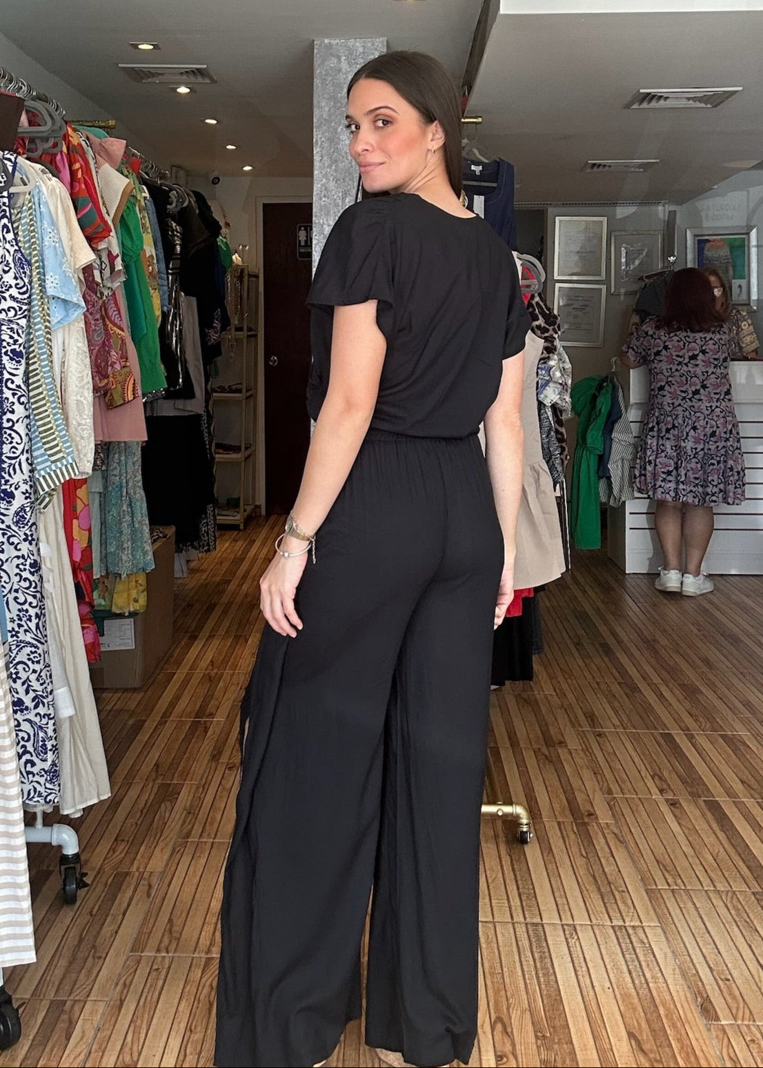 Black two piece set. Short sleeve v-neck top with matching high waisted wrap around pants.&nbsp;