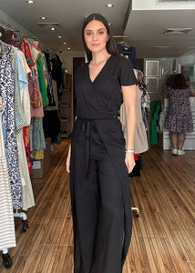 Black two piece set. Short sleeve v-neck top with matching high waisted wrap around pants.