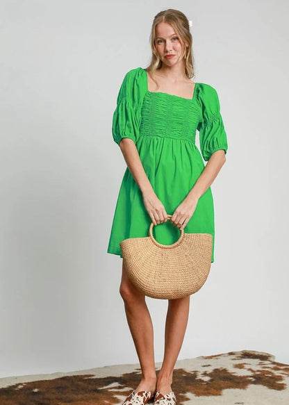 Green smocked half sleeve dress. Smocked. Balloon sleeve.