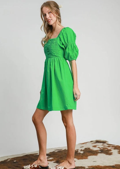 Green smocked half sleeve dress. Smocked. Balloon sleeve.
