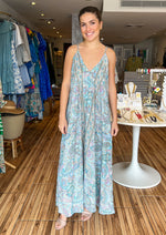 Load image into Gallery viewer, Printed v-neck maxi dress with adjustable straps and pockets.
