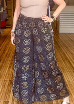 Load image into Gallery viewer, Black and gold printed loose fitting pants with stretch waist.
