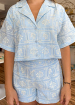 Load image into Gallery viewer, Light blue embroidered short sleeve shirt with matching shorts with pockets.
