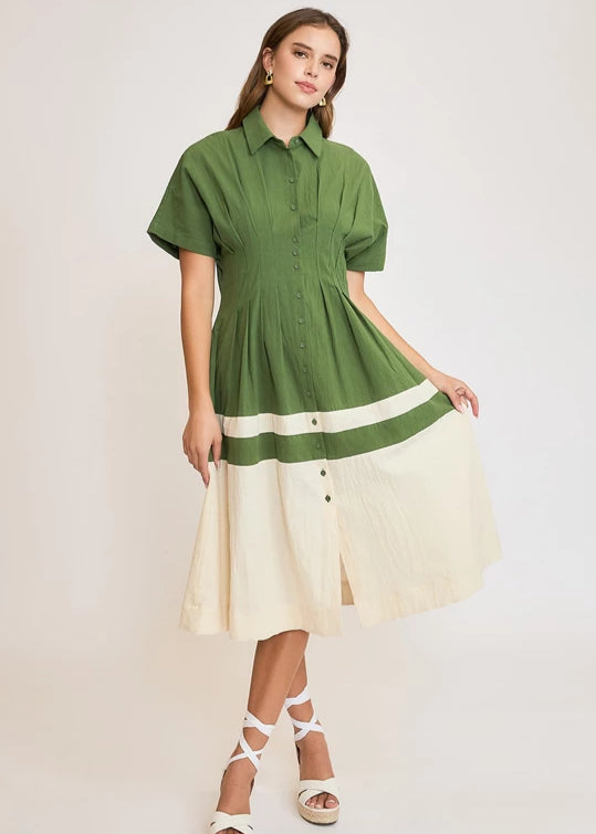 Olive color blocked midi dress with pleated details.