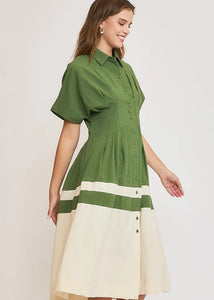 Olive color blocked midi dress with pleated details.
