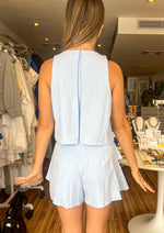 Load image into Gallery viewer, Light blue fit and flare classic ruffled romper.
